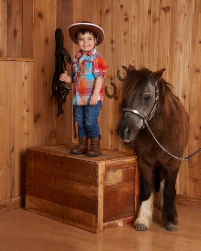 child boy cowboy with pony photoshoot